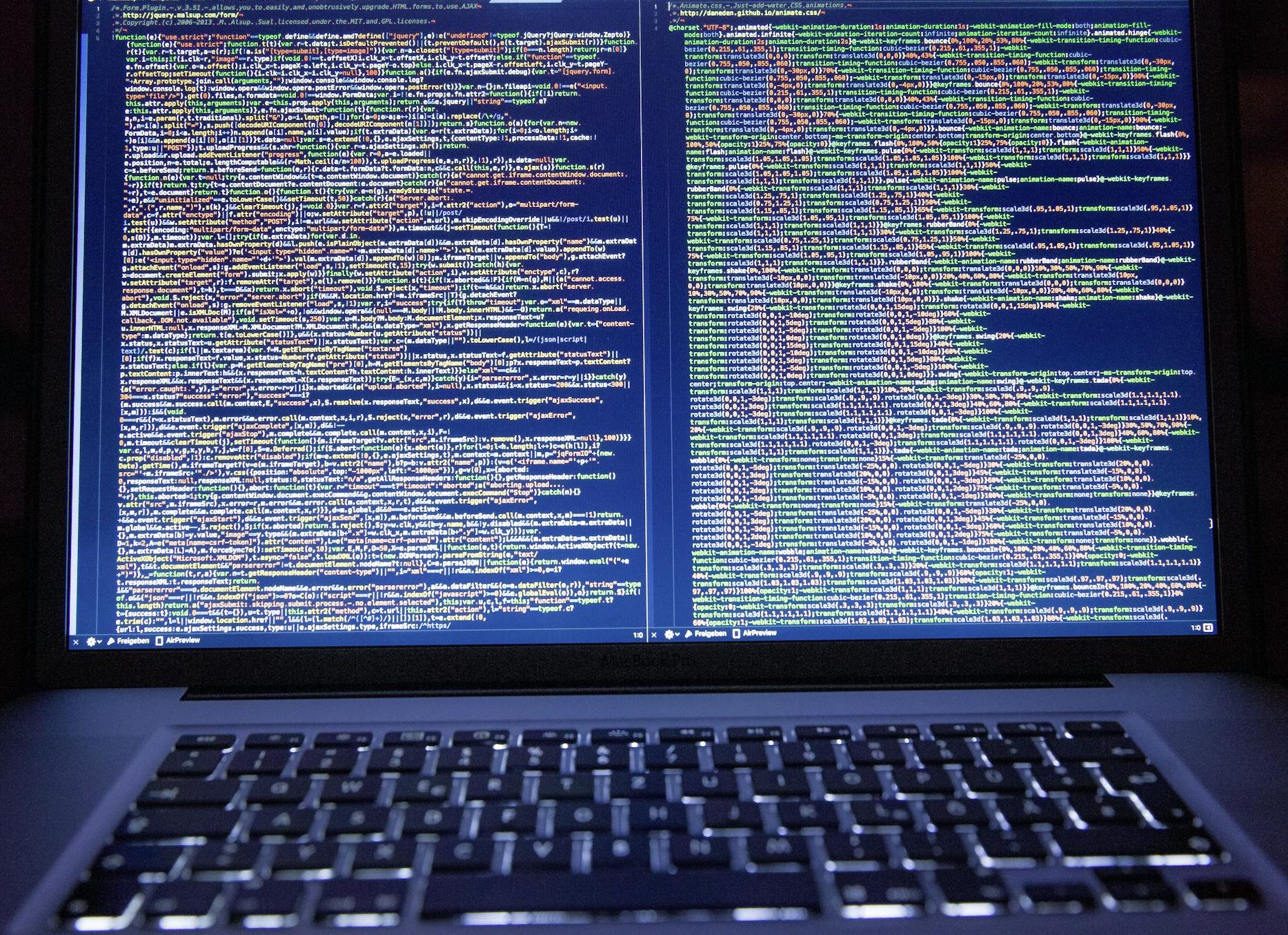 Black Laptop Computer Turned on Showing Computer Codes
